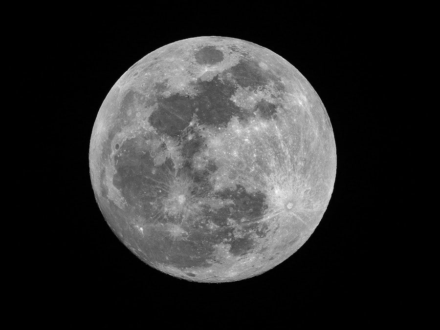 The illuminated surface of the Moon against black space